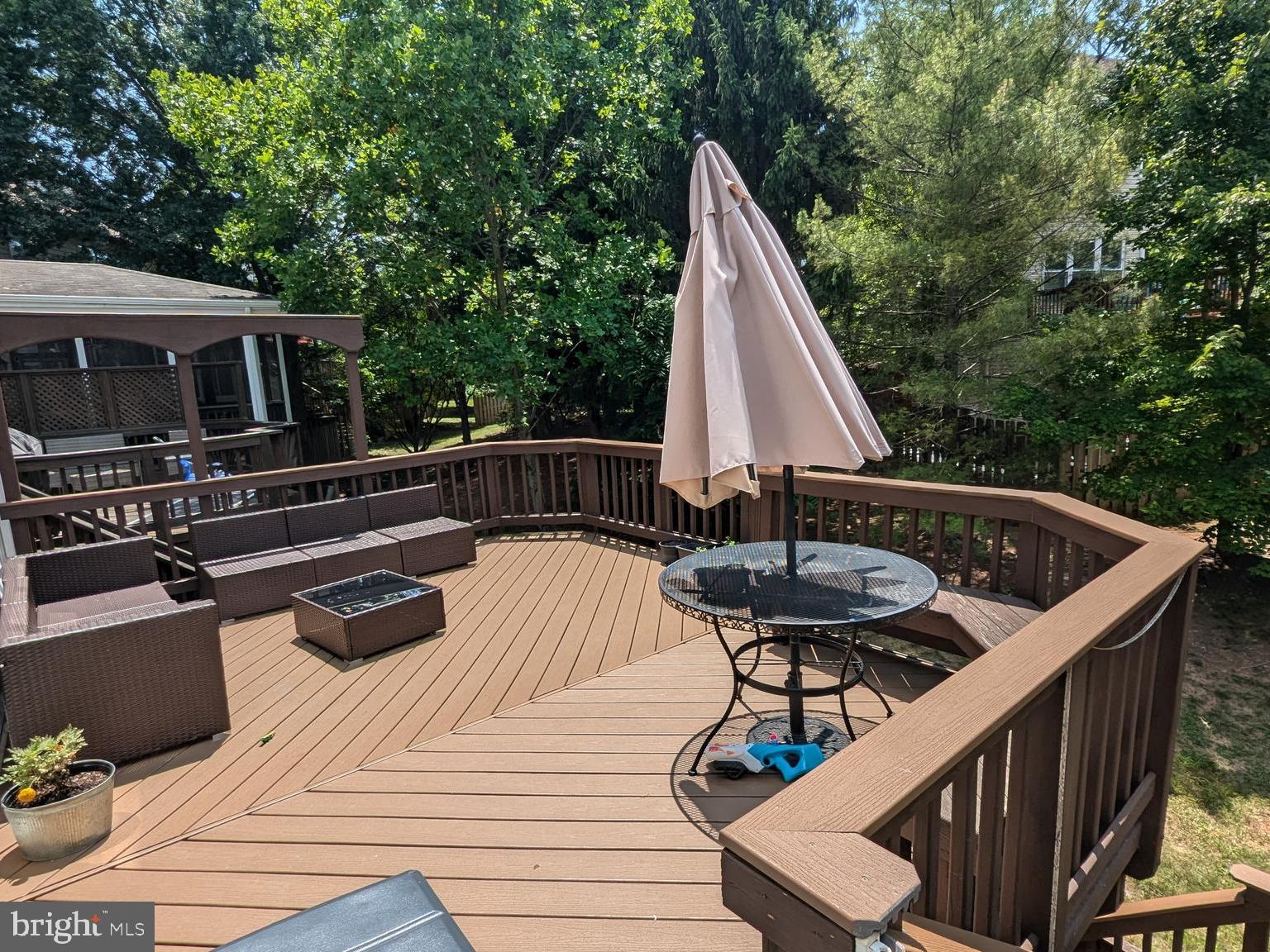 20867 Trinity Square Sterling, VA 20165 - Photo 18 of 19 a view of a roof deck with chair and wooden floor