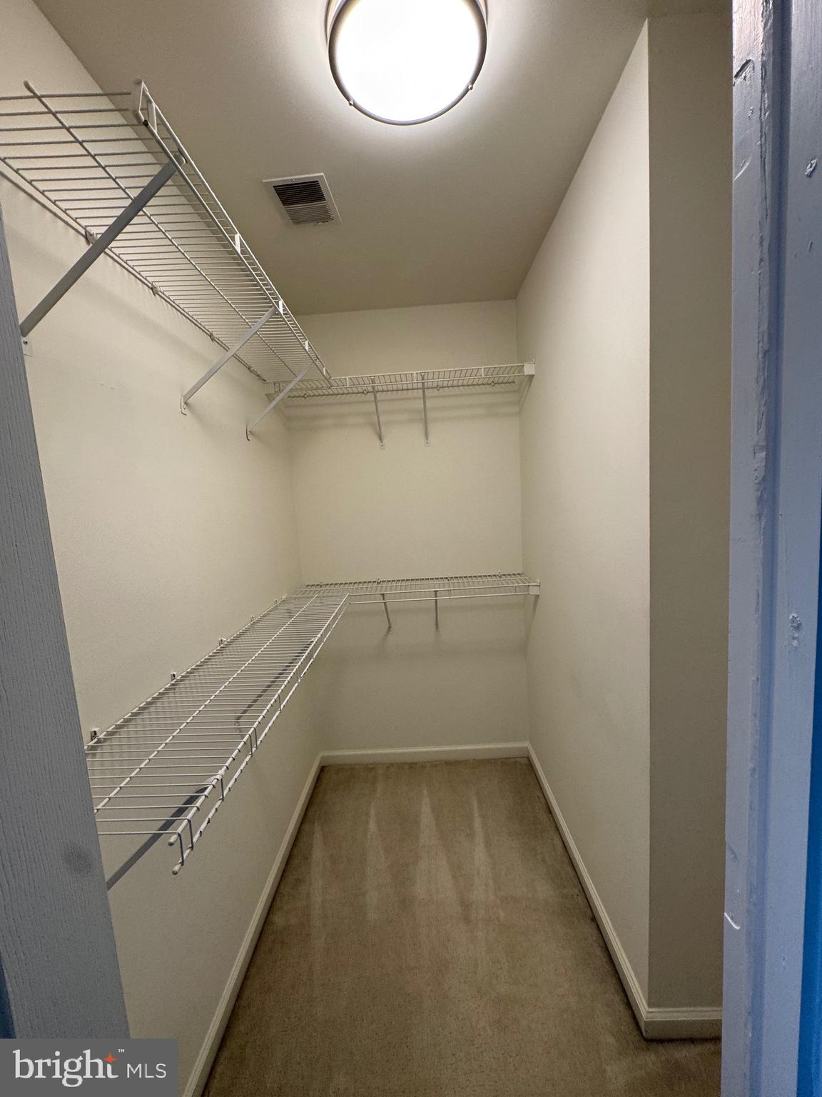 14342 Papilion Way Centreville, VA 20121 - Photo 33 of 46 a view of a room with racks on the wall