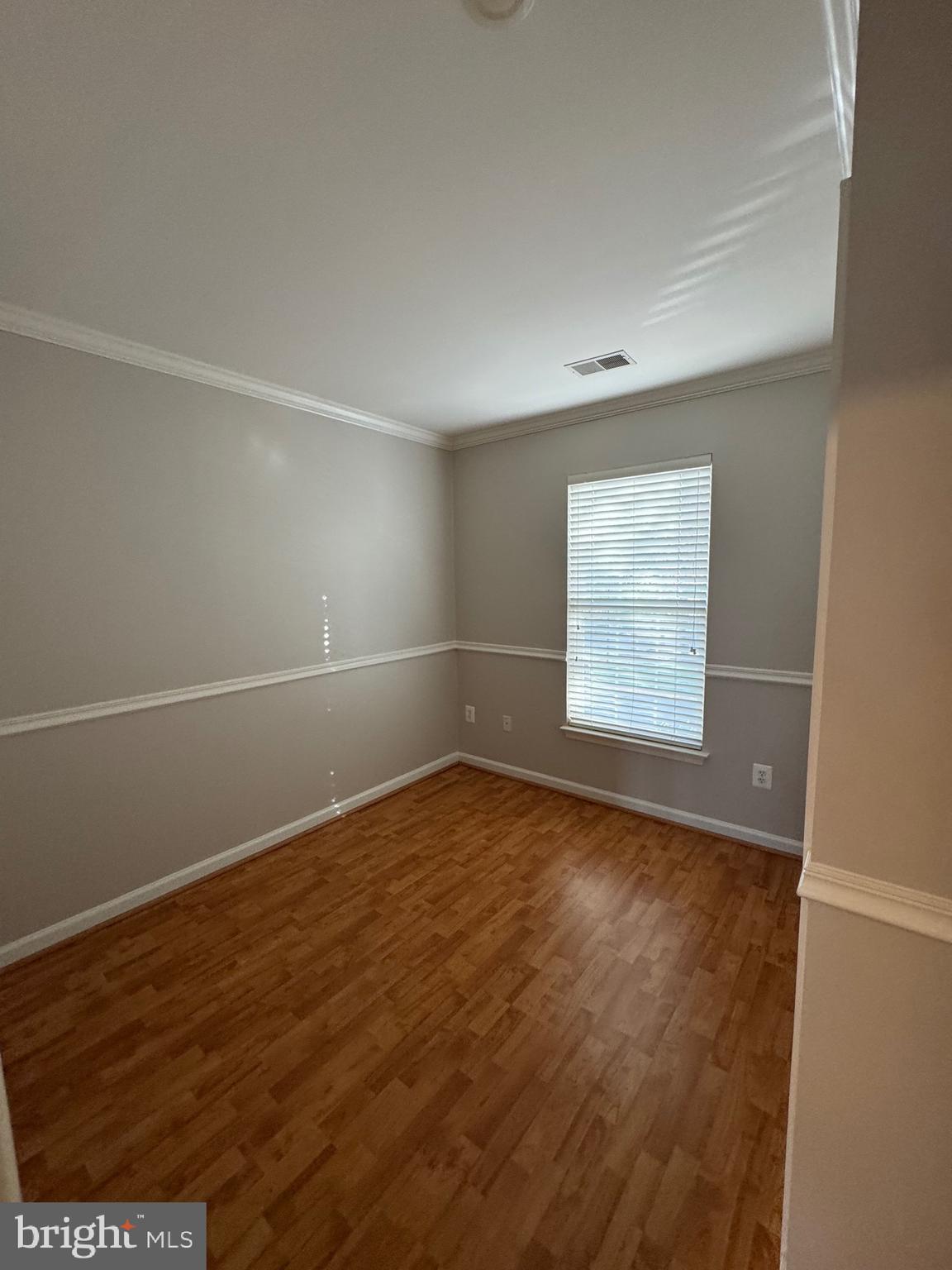 14342 Papilion Way Centreville, VA 20121 - Photo 35 of 46 an empty room with wooden floor and windows