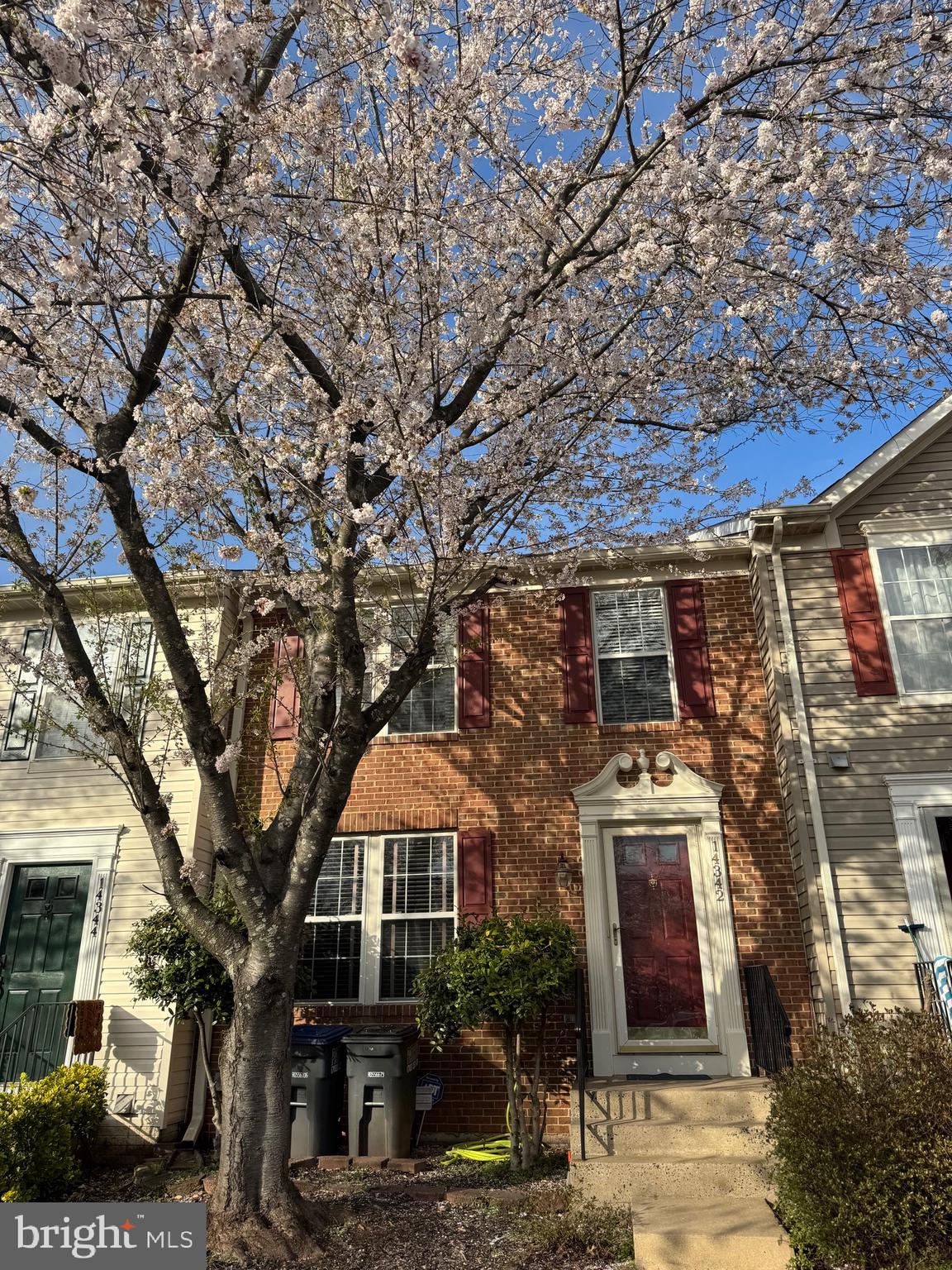 14342 Papilion Way Centreville, VA 20121 - Photo 5 of 46 a front view of a house with a garden