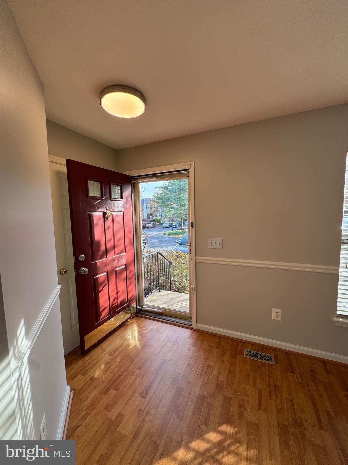 14342 Papilion Way Centreville, VA 20121 - Photo 7 of 46 wooden floor in an empty room with a window