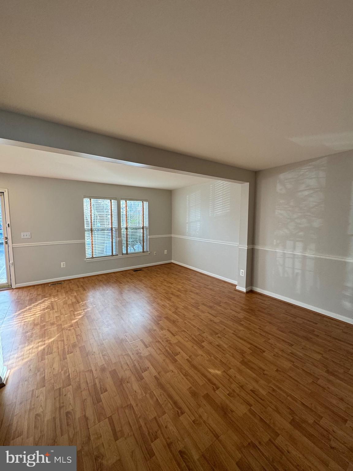 14342 Papilion Way Centreville, VA 20121 - Photo 8 of 46 wooden floor in an empty room with a window