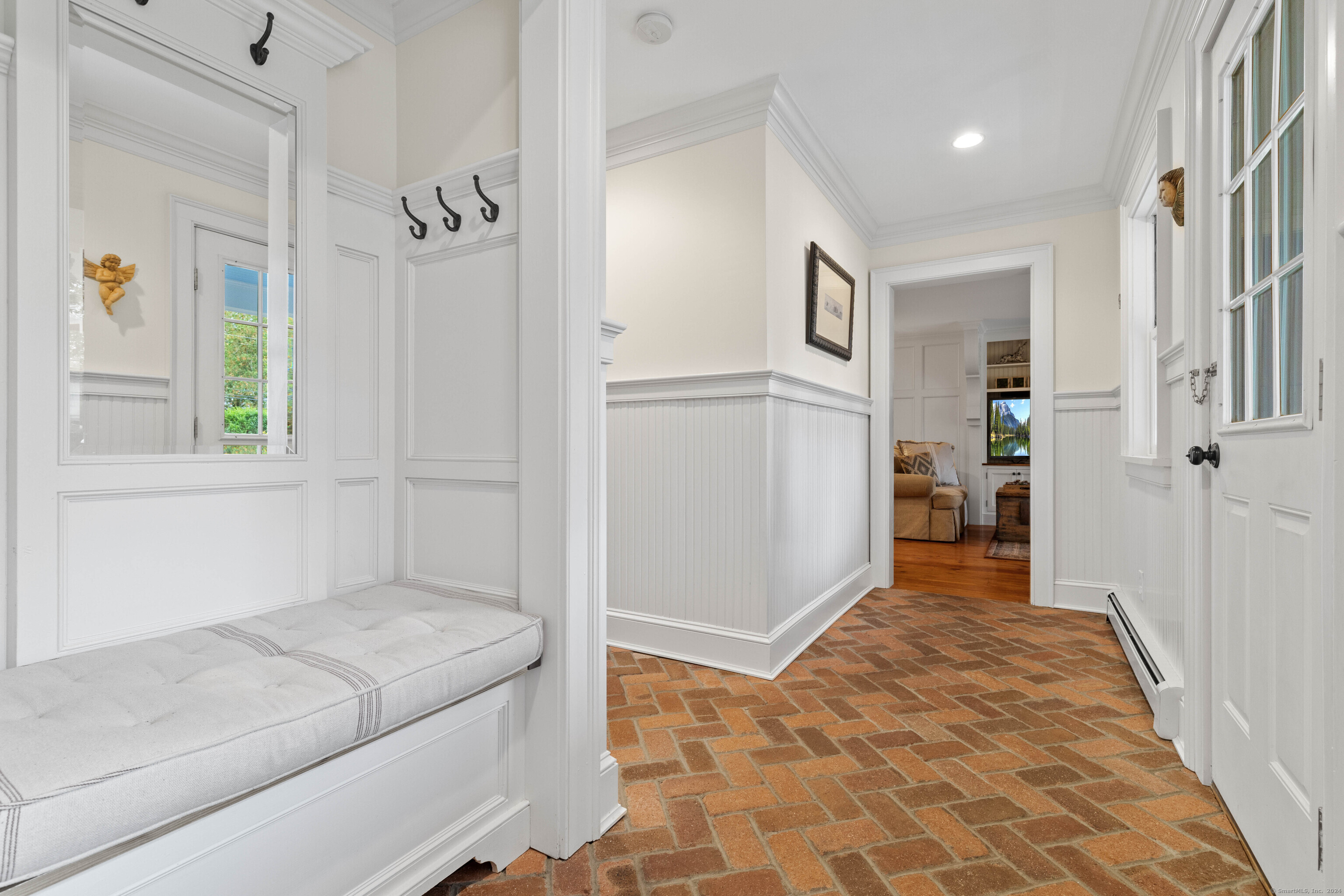 1 Hathaway Road East Lyme, CT 06333 - Photo 12 of 38 the breezeway from the garage has seating, access to the bathroom/laundry room and features stunning floors