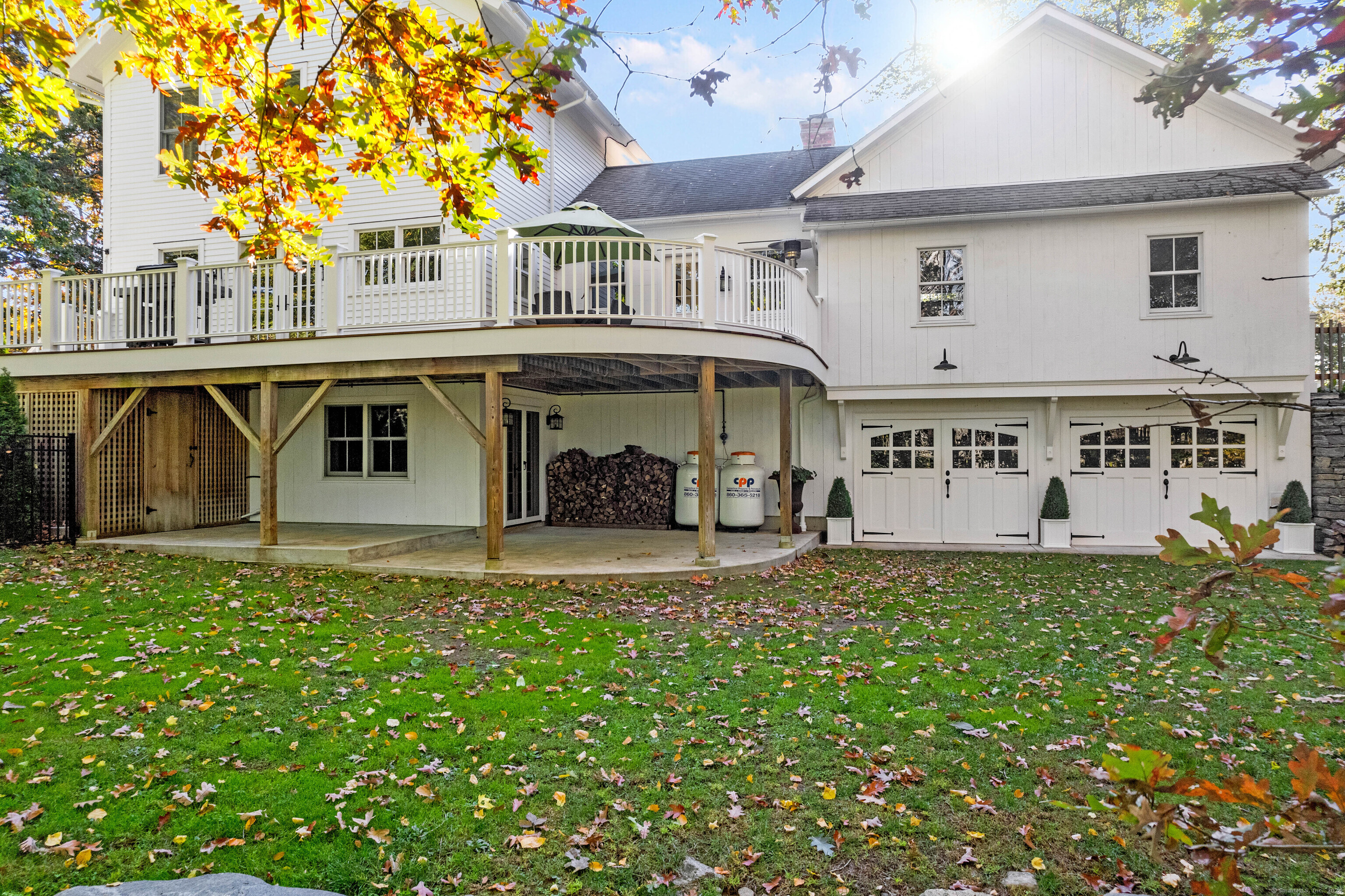 1 Hathaway Road East Lyme, CT 06333 - Photo 35 of 38 The back of the home with the upper level Ipe deck, lower patio and the lower level 2 car garage