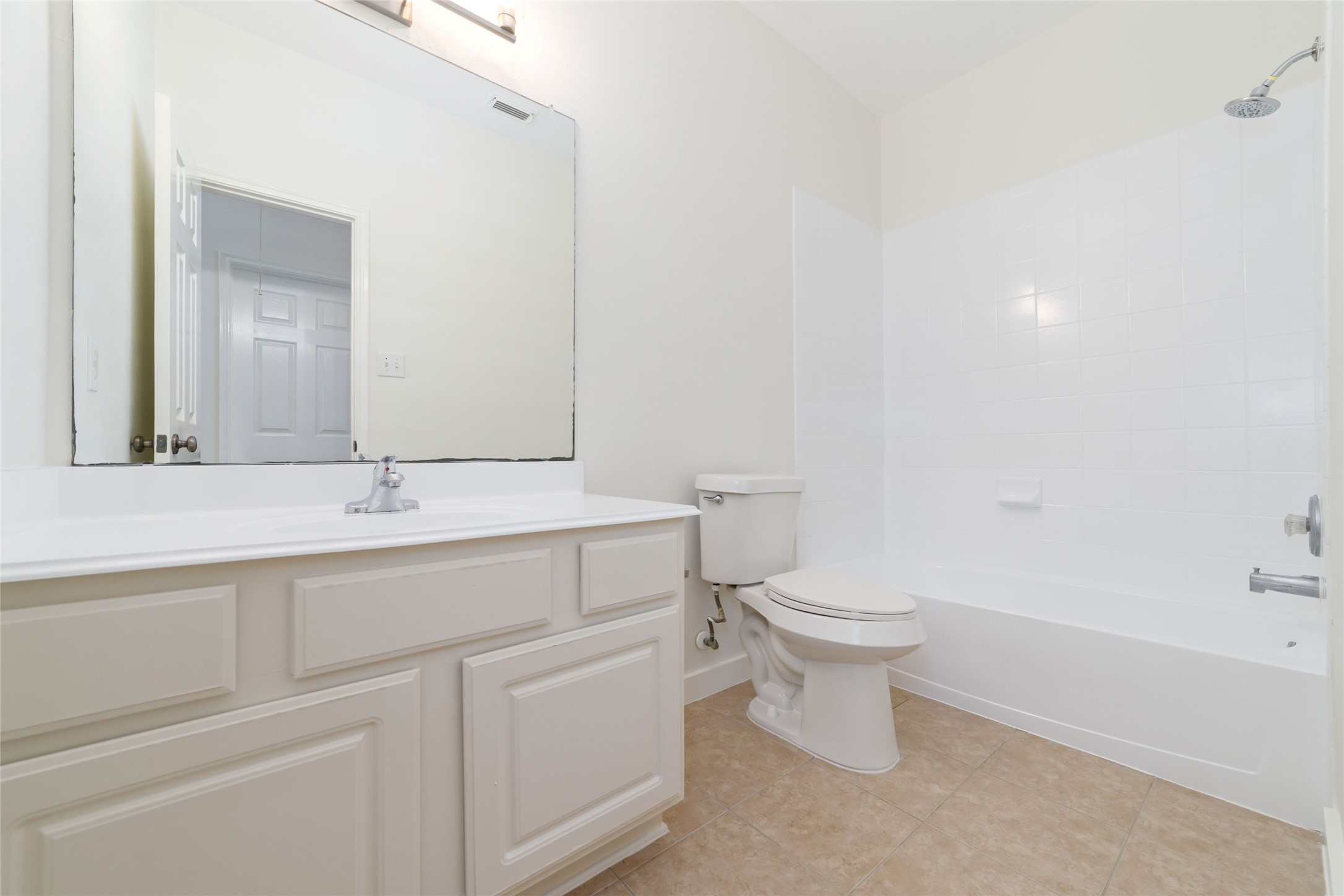 20215 Enchanted Rose Cypress, TX 77433 - Photo 16 of 23 a bathroom with a sink a toilet and a mirror