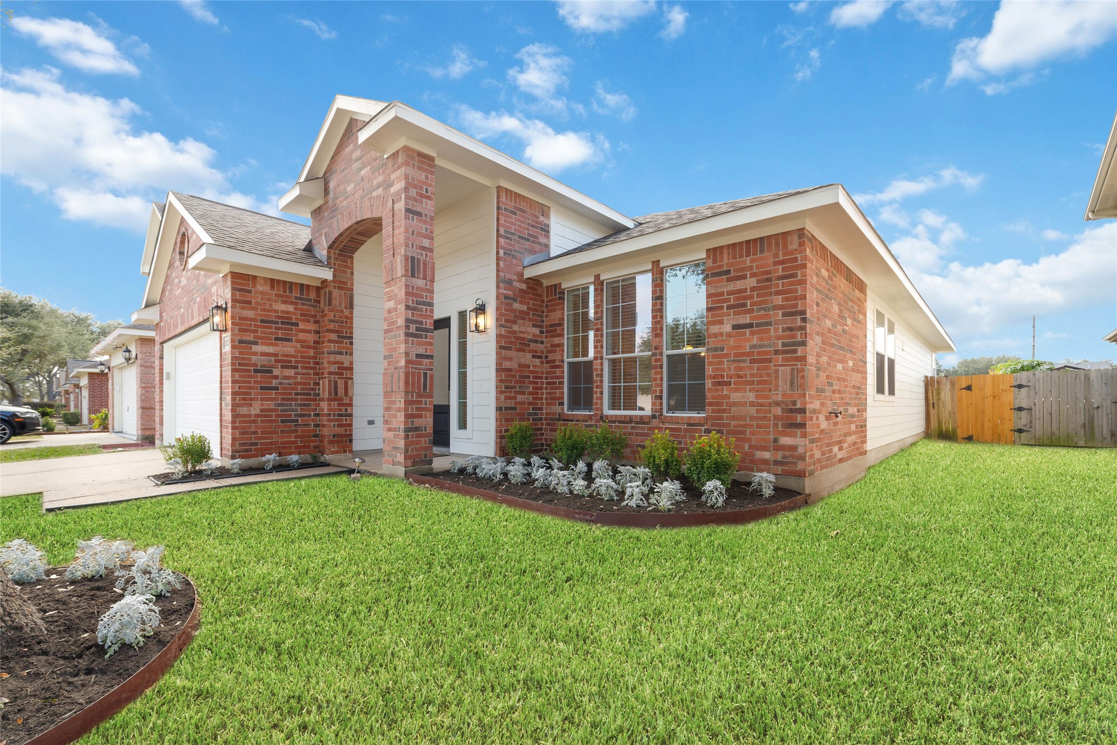 20215 Enchanted Rose Cypress, TX 77433 - Photo 2 of 23 a front view of a house with a garden