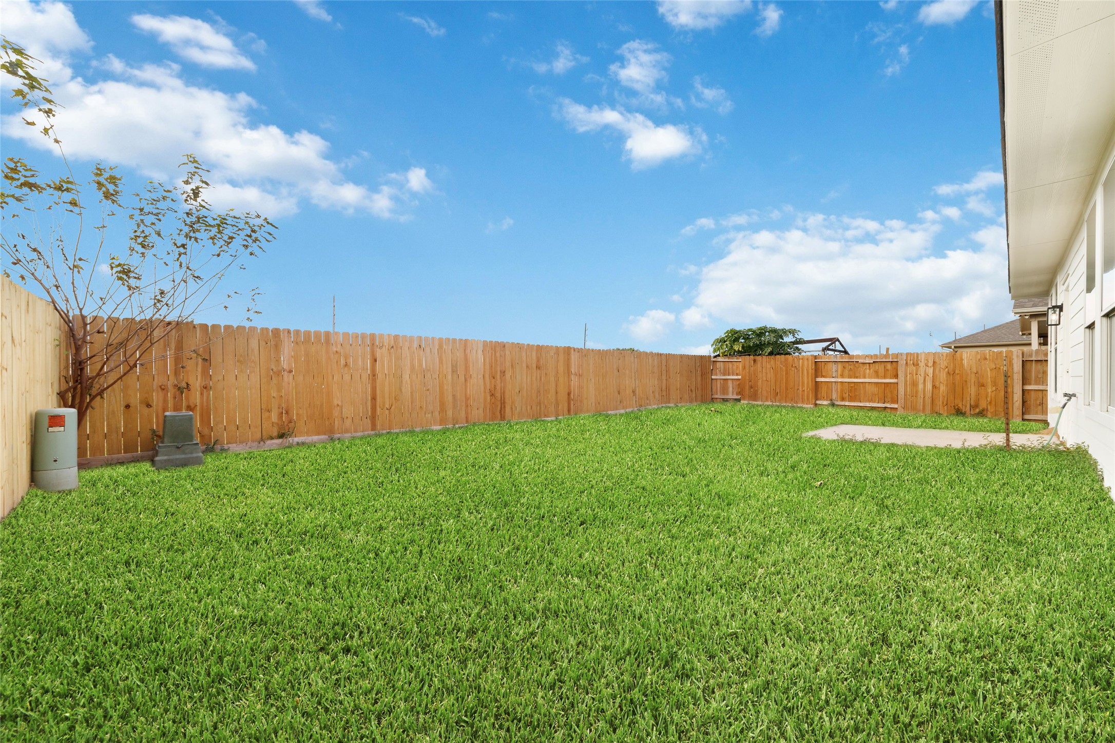 20215 Enchanted Rose Cypress, TX 77433 - Photo 23 of 23 a view of yard with grass and wooden fence