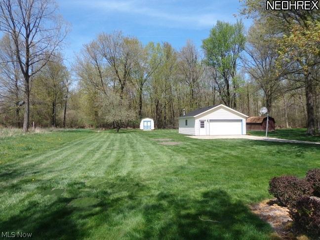 36490 Aurensen Road North Ridgeville, OH 44039 - Photo 3 of 24 Lots of room to roam with this yard. Lot dimensions are: 76.50 x 285. The 2-1/2 car garage is heated with its own upgraded electric panel.
