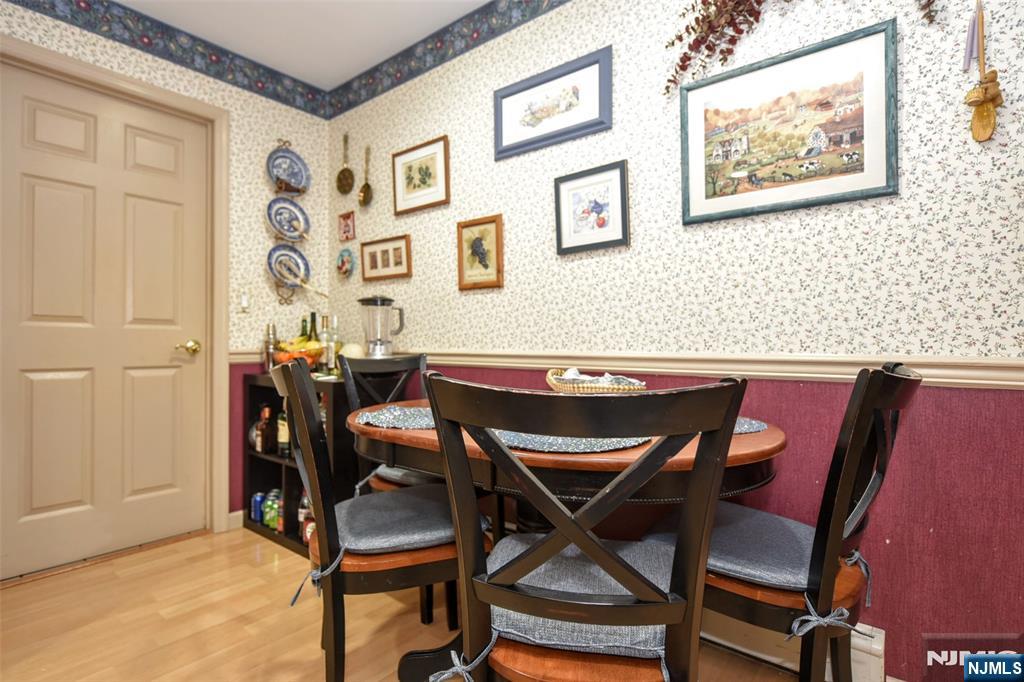 84 West Midland Avenue Paramus, NJ 07652 - Photo 14 of 37 a view of a dining room with furniture and a chandelier