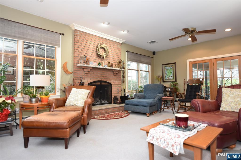 84 West Midland Avenue Paramus, NJ 07652 - Photo 18 of 37 a living room with furniture fireplace and a large window