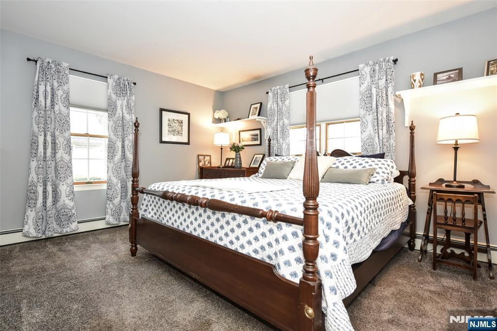 84 West Midland Avenue Paramus, NJ 07652 - Photo 20 of 37 a bedroom with a bed chair and window