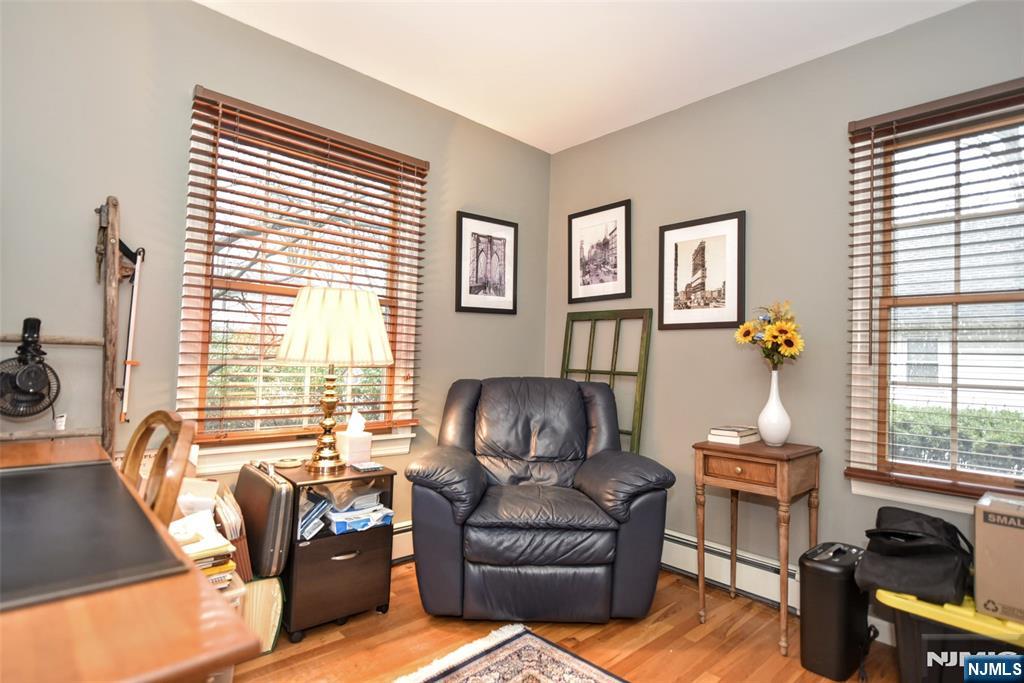 84 West Midland Avenue Paramus, NJ 07652 - Photo 21 of 37 a living room with furniture and a large window
