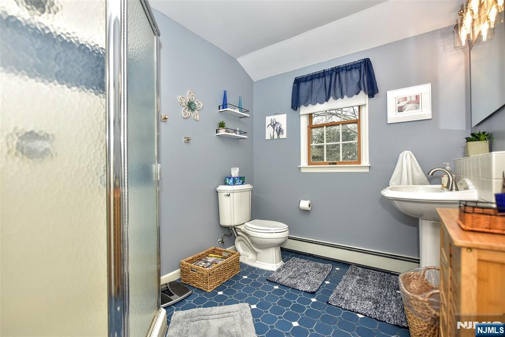 84 West Midland Avenue Paramus, NJ 07652 - Photo 24 of 37 a bathroom with a sink toilet and shower