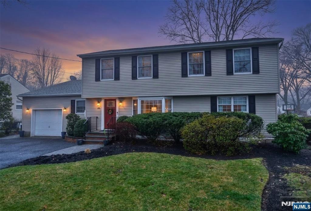 84 West Midland Avenue Paramus, NJ 07652 - Photo 33 of 37 a front view of a house with a yard