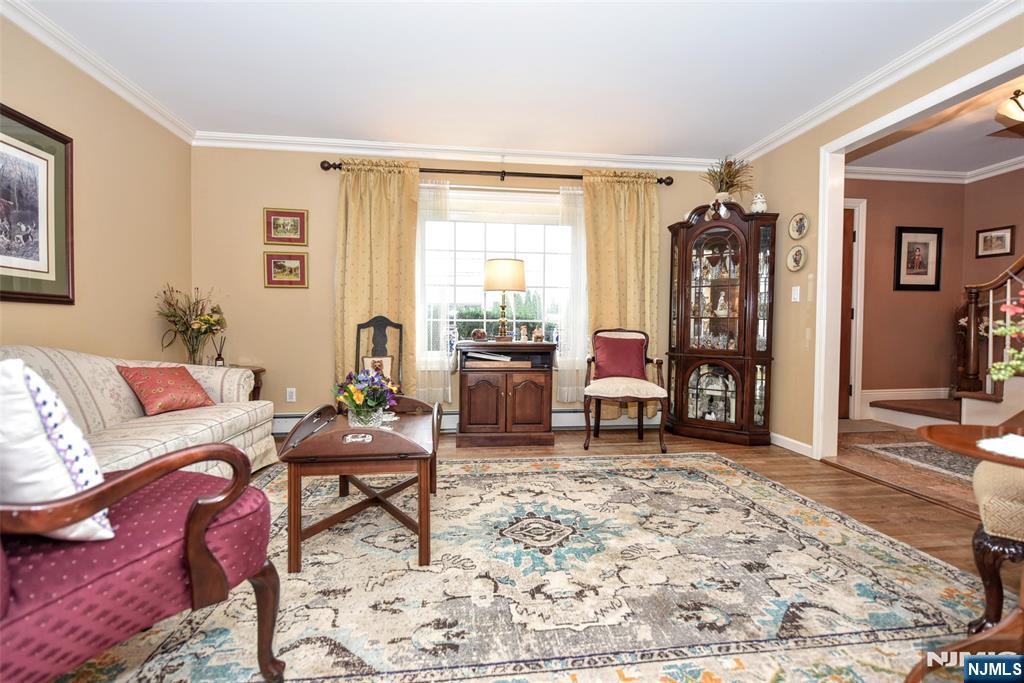 84 West Midland Avenue Paramus, NJ 07652 - Photo 6 of 37 a living room with furniture and a window