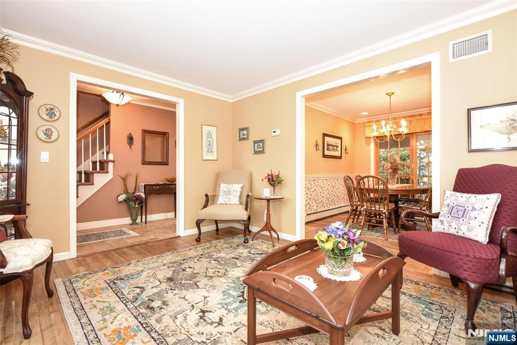 84 West Midland Avenue Paramus, NJ 07652 - Photo 7 of 37 a living room with furniture and a wooden floor