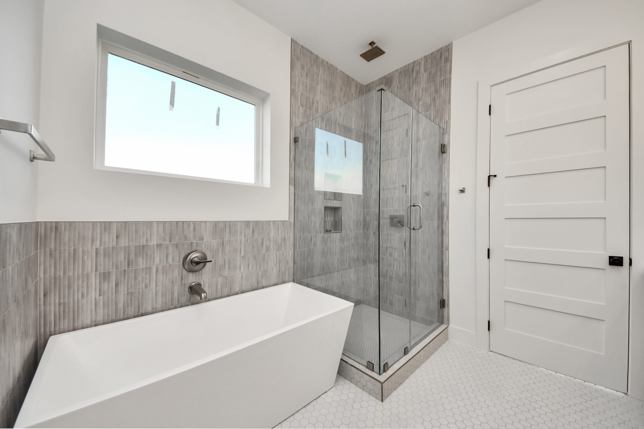 4819 Austin Street, Unit B Houston, TX 77004 - Photo 26 of 49 a bathroom with a bathtub and a shower