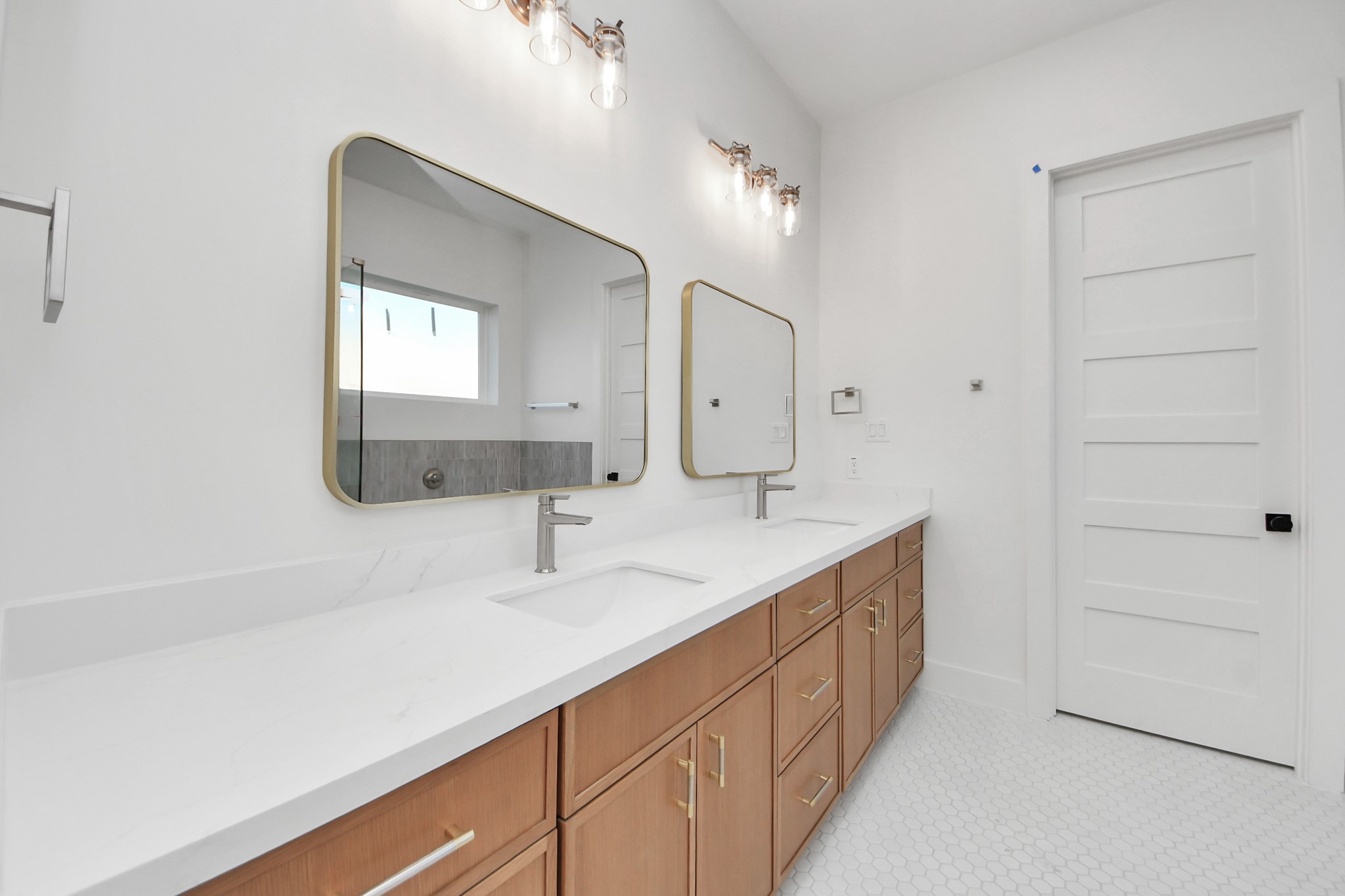 4819 Austin Street, Unit B Houston, TX 77004 - Photo 27 of 49 a bathroom with a double vanity sink and mirror