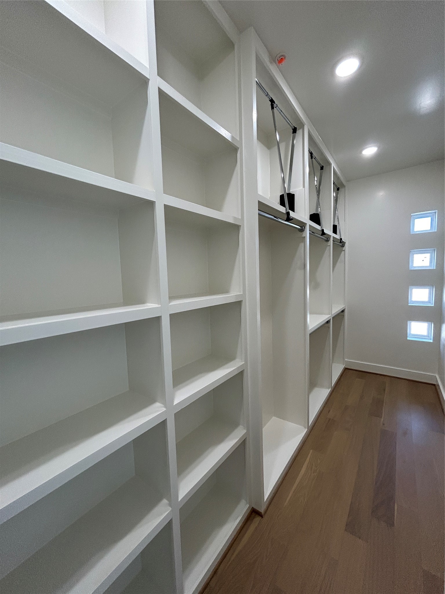 4819 Austin Street, Unit B Houston, TX 77004 - Photo 29 of 49 a view of walk in closet with empty racks