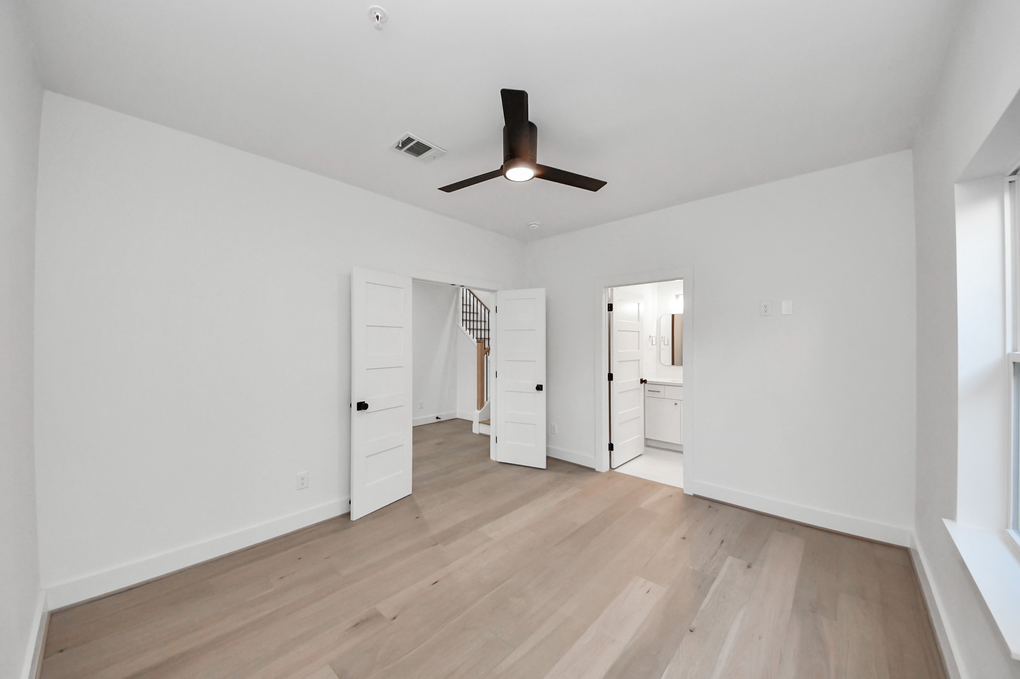 4819 Austin Street, Unit B Houston, TX 77004 - Photo 31 of 49 wooden floor in an empty room with a window