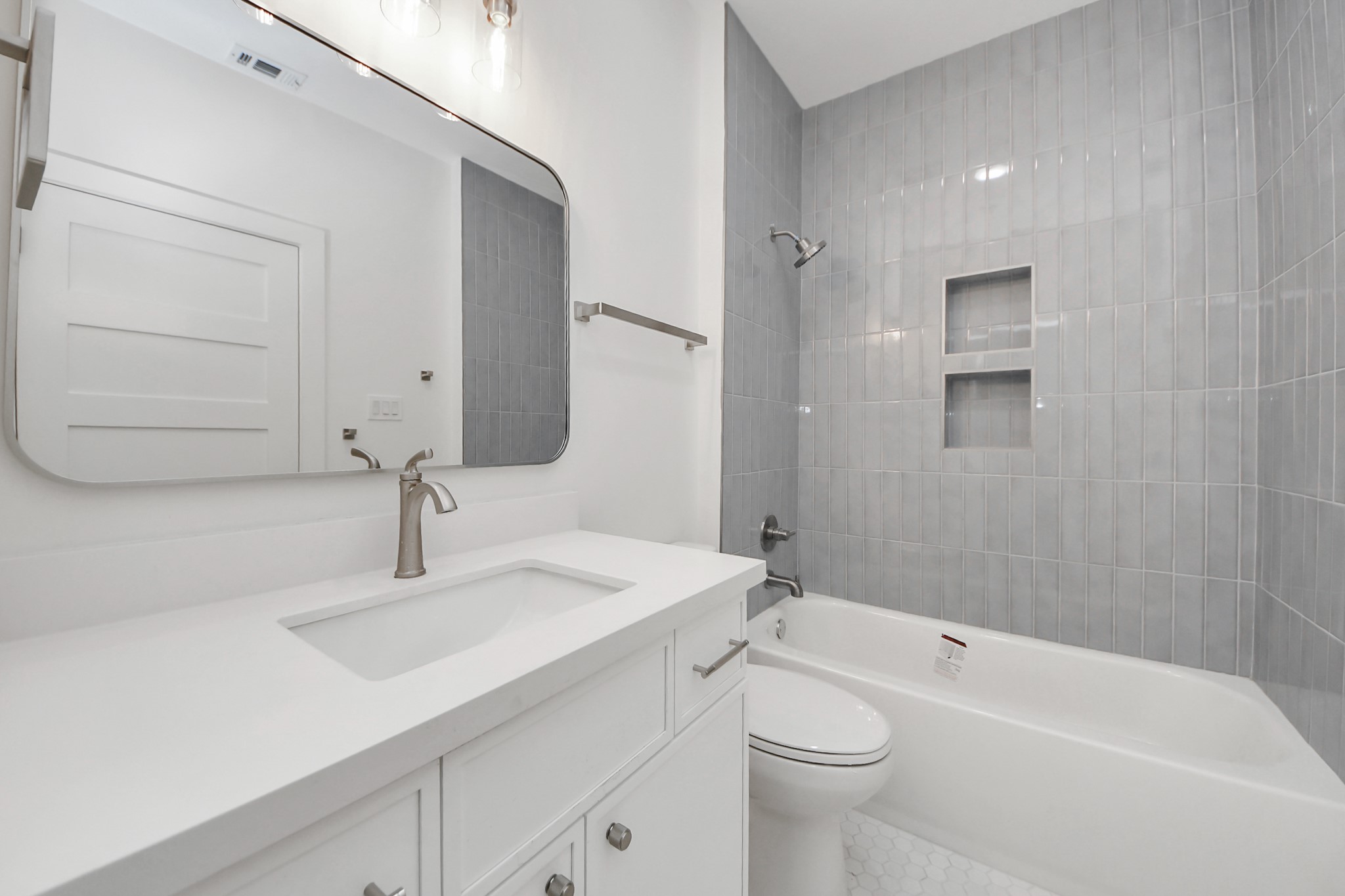 4819 Austin Street, Unit B Houston, TX 77004 - Photo 33 of 49 a bathroom with a sink a toilet and shower