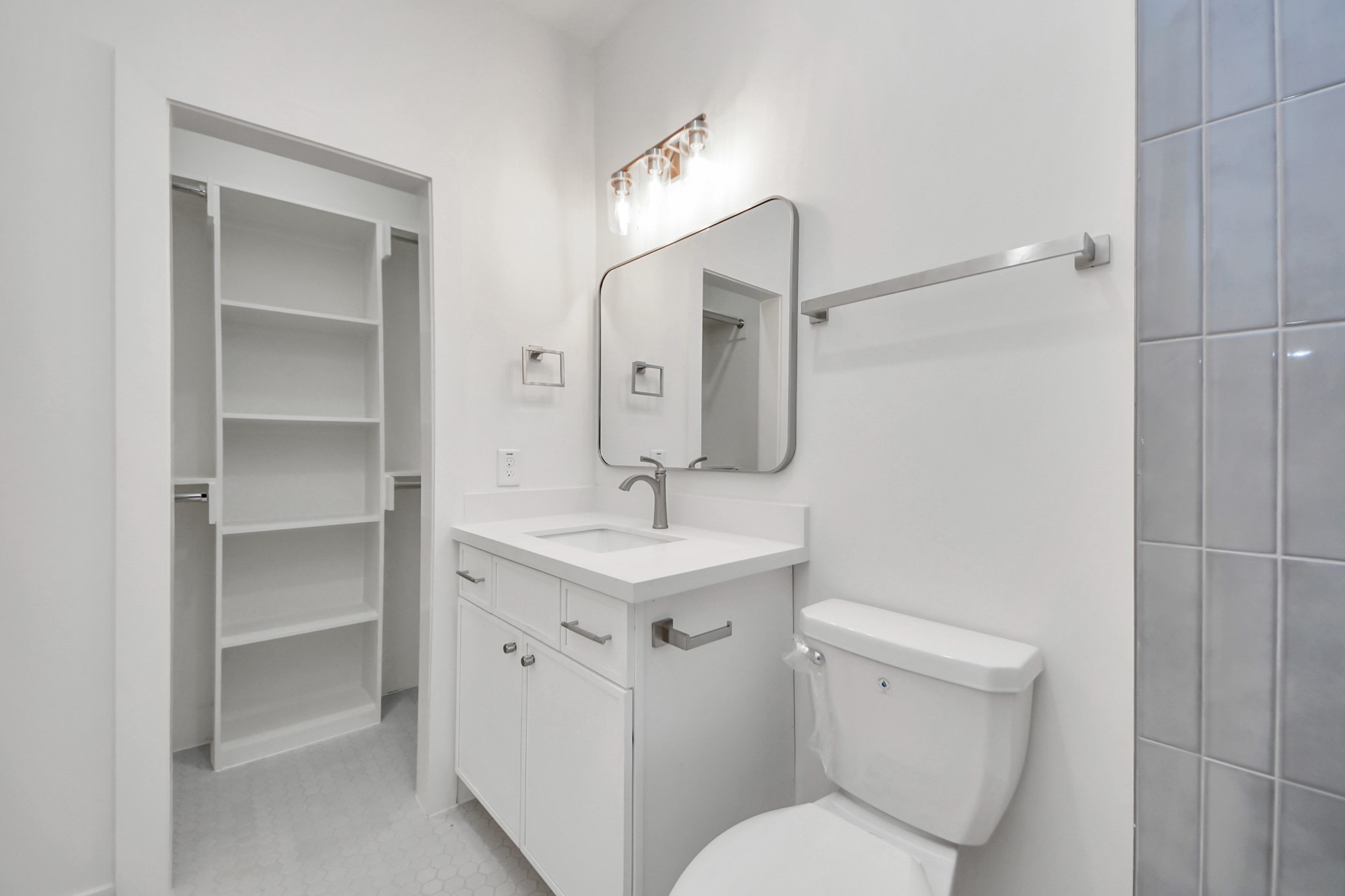 4819 Austin Street, Unit B Houston, TX 77004 - Photo 34 of 49 a bathroom with a toilet sink and mirror