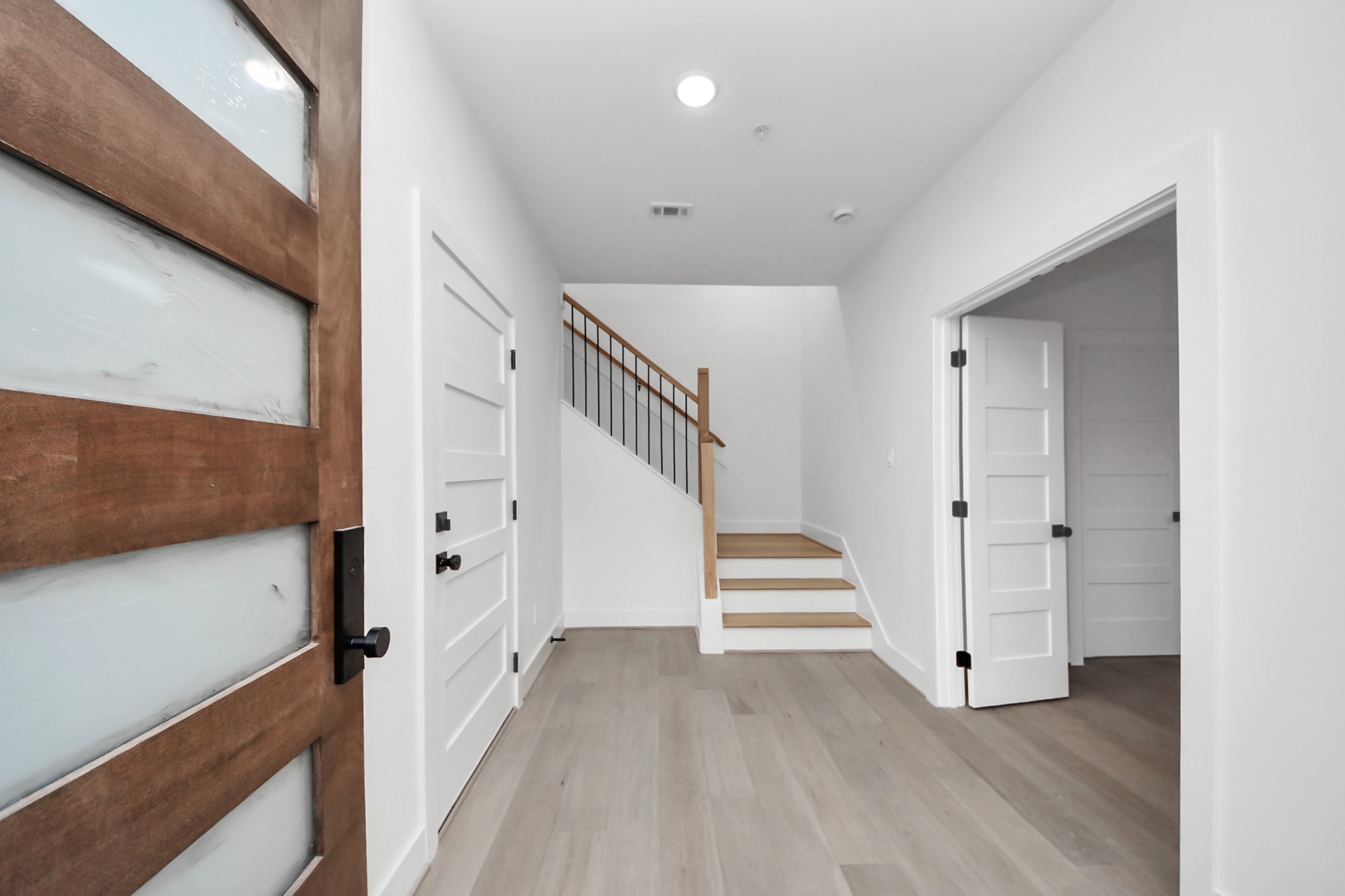 4819 Austin Street, Unit B Houston, TX 77004 - Photo 8 of 49 a view of a hallway with wooden floor and entryway