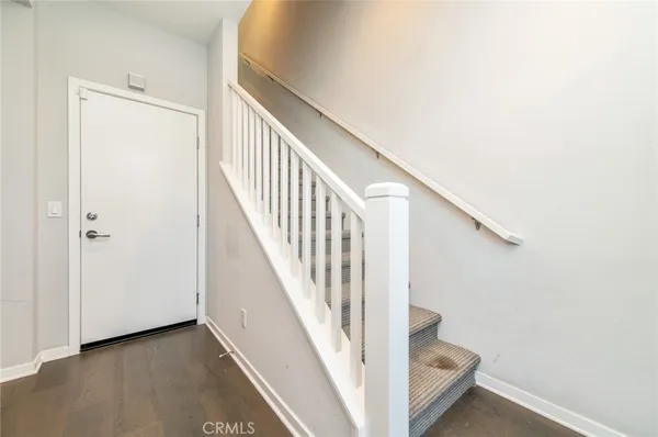 a view of a hallway with staircase