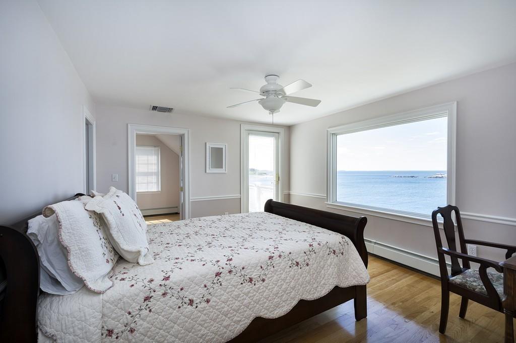 481 Jerusalem Road Cohasset, MA 02025 - Photo 19 of 30 a bedroom with a bed and a table with chair