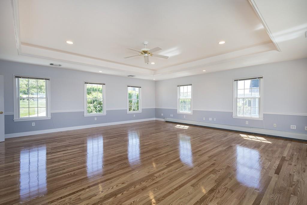 481 Jerusalem Road Cohasset, MA 02025 - Photo 23 of 30 an empty room with wooden floor and windows