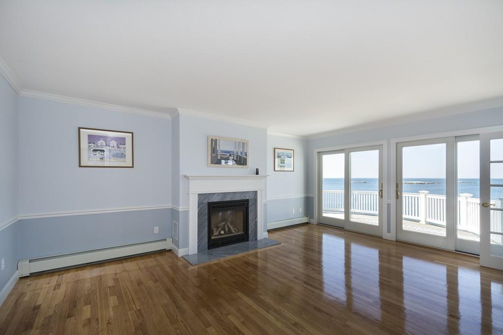 481 Jerusalem Road Cohasset, MA 02025 - Photo 10 of 30 a living room with furniture and a fireplace