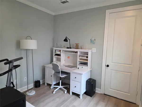 a view of workspace with wooden floor