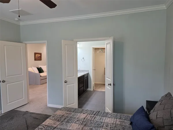 a bedroom with a bed and a couch