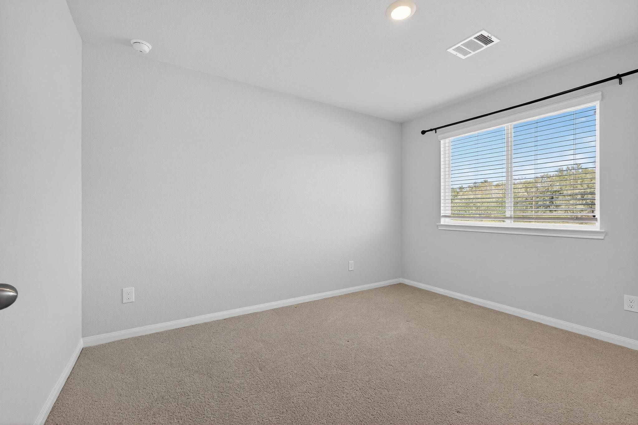 1409 Mount Bassie Trail Conroe, TX 77301 - Photo 16 of 26 an empty room with a window