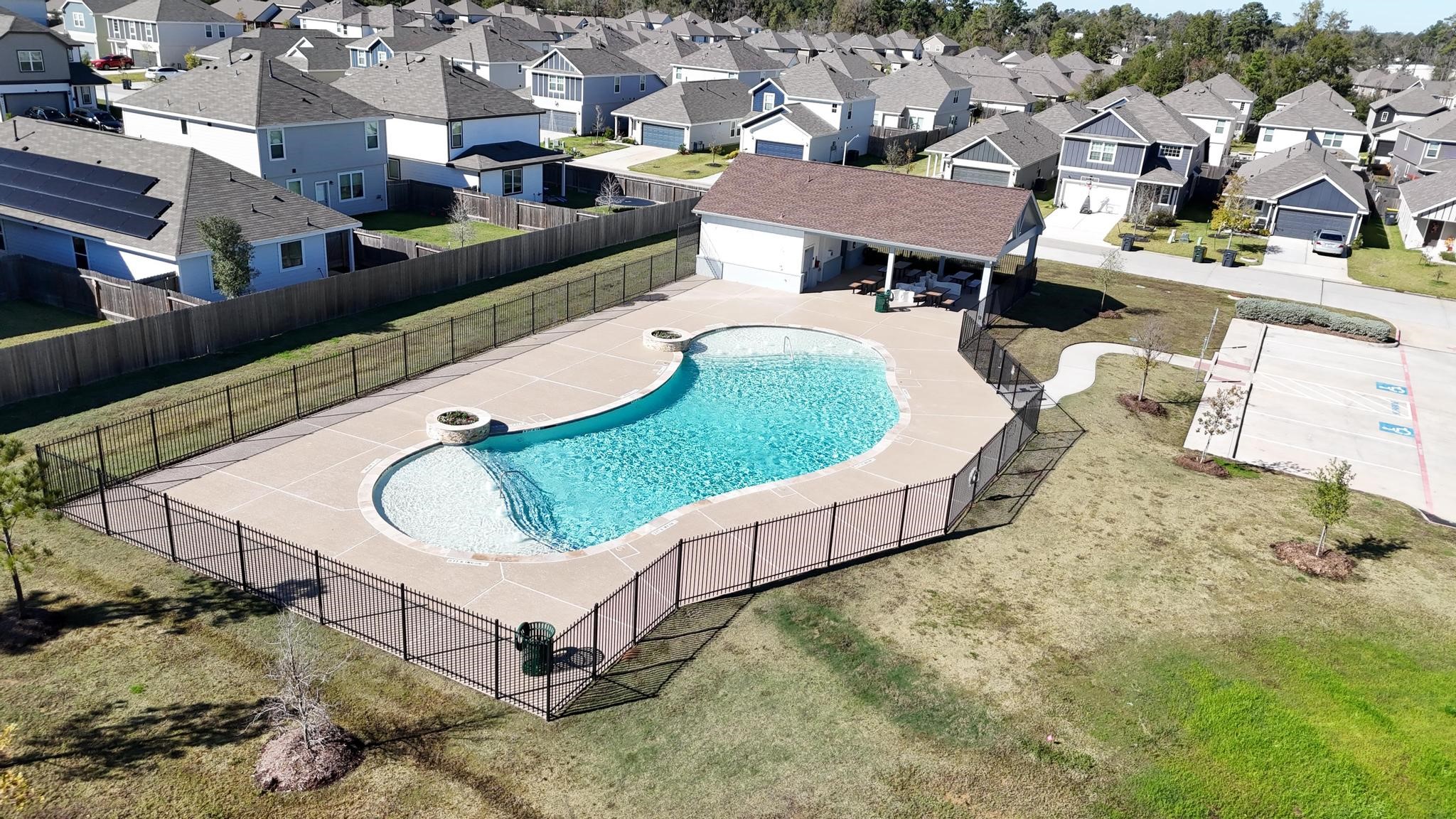 1409 Mount Bassie Trail Conroe, TX 77301 - Photo 26 of 26 an aerial view of a house with swimming pool and a yard