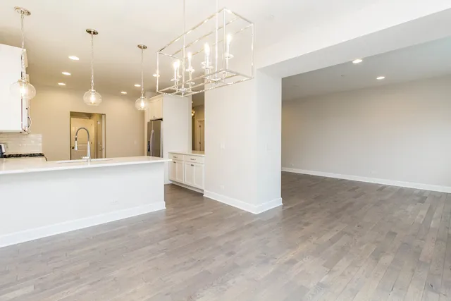 a view of a kitchen and a chandelier