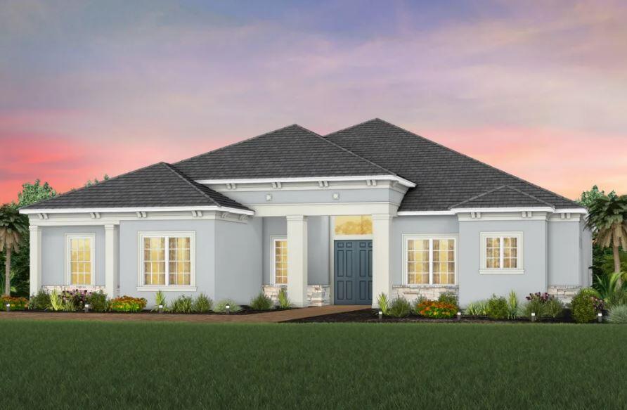 20153 Southeast Bridgewater Drive Jupiter, FL 33458 - Photo 8 of 19 a front view of a house with a yard