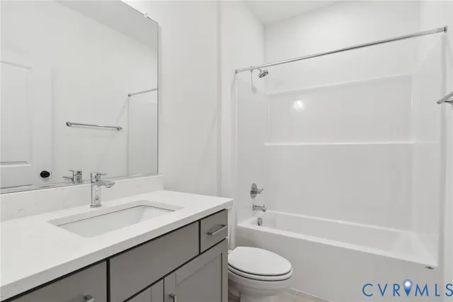 a bathroom with a sink a toilet and a bathtub