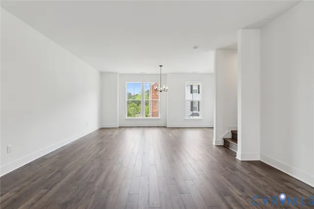 a view of livingroom with hardwood floor and hallway