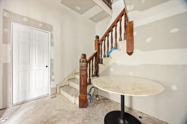 a view of a bedroom with wooden floor and bedroom space
