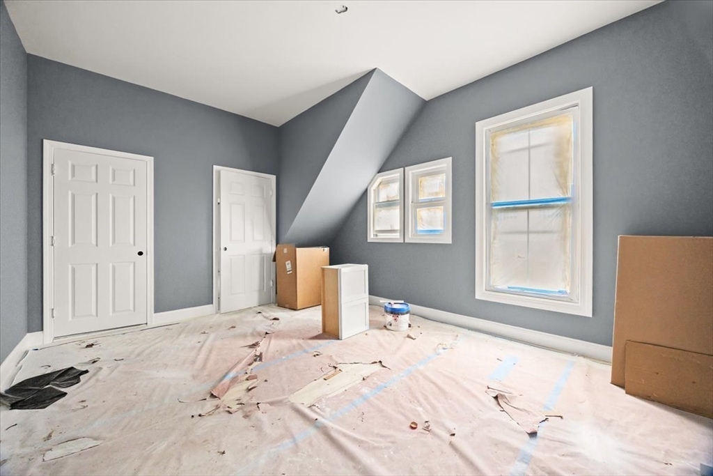 150 Purchase Street Fall River, MA 02720 - Photo 14 of 42 a view of a bedroom with wooden floor and bedroom space