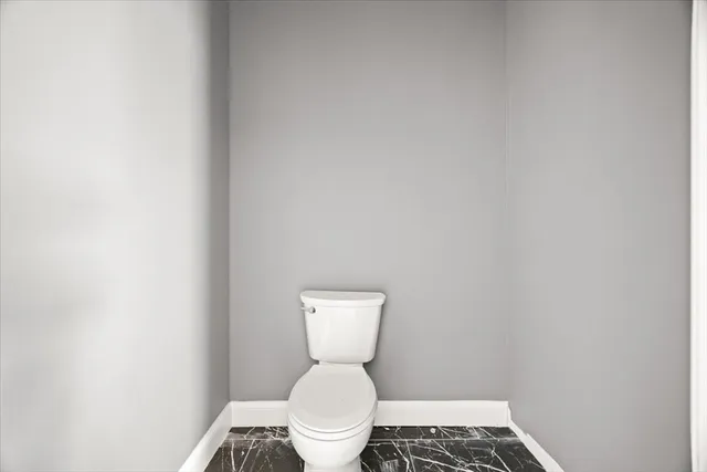 a bed room with a window and a lamp