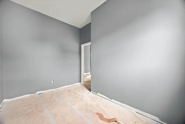 a view of a room with wooden walls