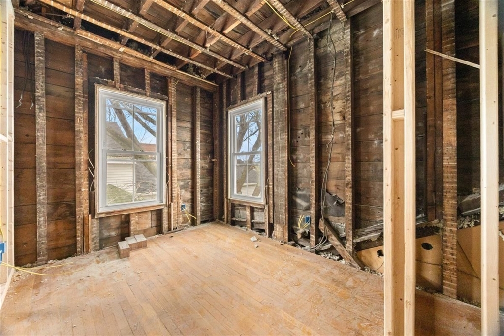 150 Purchase Street Fall River, MA 02720 - Photo 27 of 42 a view of a room with a large window and chair