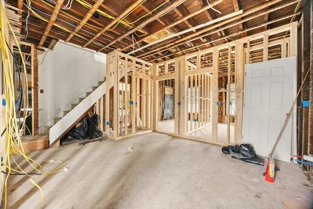 a view of a room with a white walls