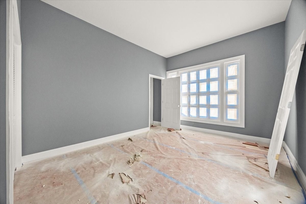 150 Purchase Street Fall River, MA 02720 - Photo 3 of 42 a view of an empty room with a window