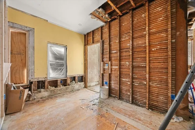 a view of livingroom with furniture and large window