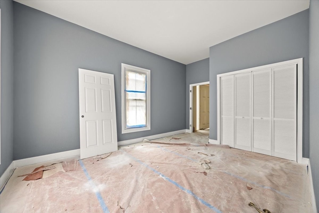 150 Purchase Street Fall River, MA 02720 - Photo 5 of 42 a view of a livingroom with a staircase