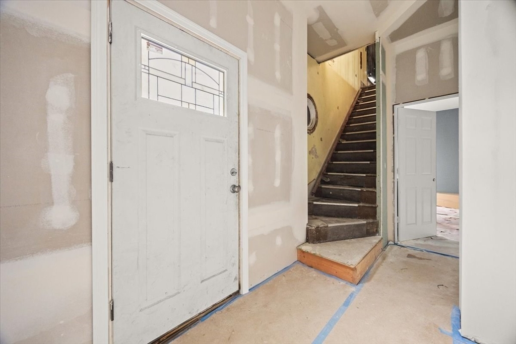 150 Purchase Street Fall River, MA 02720 - Photo 10 of 42 a view of entryway with wooden floor and stairs