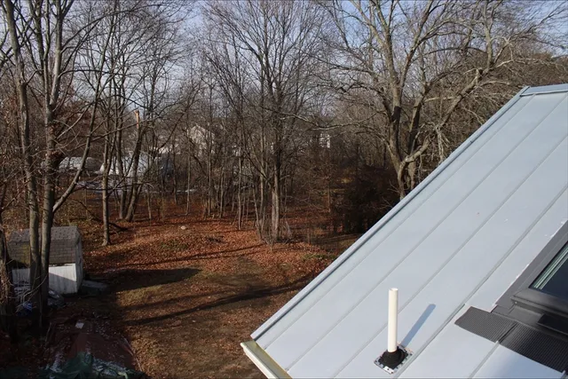 a kitchen with stainless steel appliances white cabinets and a stove